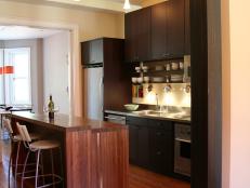 Contemporary Kitchen With Brown Wood Island and Espresso Wood Cabinets