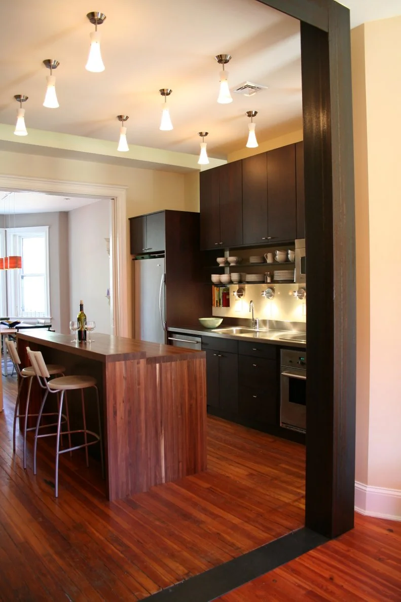 Contemporary Kitchen With Brown Wood Island and Espresso Wood Cabinets