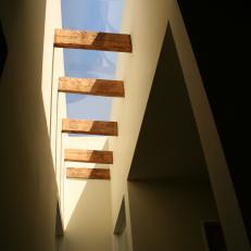 Contemporary Skylight With Rustic Wood Accents