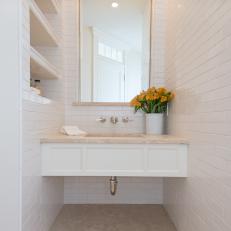 White Tile Powder Room with Built-In Wall Shelving