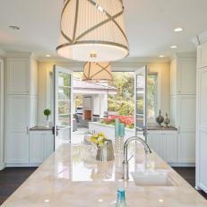 Dreamy All-White Kitchen With Stylish Pendant Lights