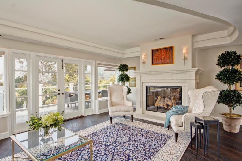 Traditional White Living Space With Fireplace and French Doors