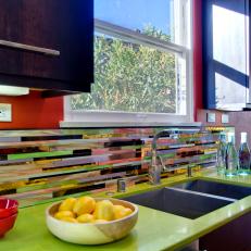 Multicolored Backsplash and Lime Green Countertops in Bright, Eclectic Kitchen