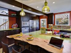 Bold Eclectic Kitchen With Rich, Brown Cabinetry and Island
