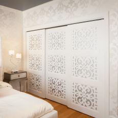 Chic White Bedroom With Patterned Closet Doors