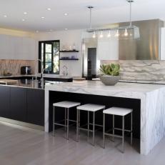 Modern Black and White Kitchen With Marble Countertops