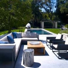 Modern Poolside Lounge Area With Neutral Sectional