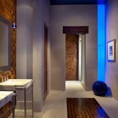 Modern Spa Bathroom With Teak Wall Tiles and Blue Accents