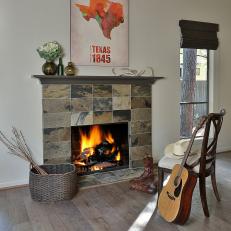 Updated Slate Fireplace With Stone Tiles and Hardwood Floor