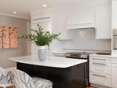 A Clean and Streamlined Kitchen With White Tile Backsplash