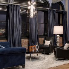 Navy Drapes and Dark Furniture in Bedroom Sitting Area
