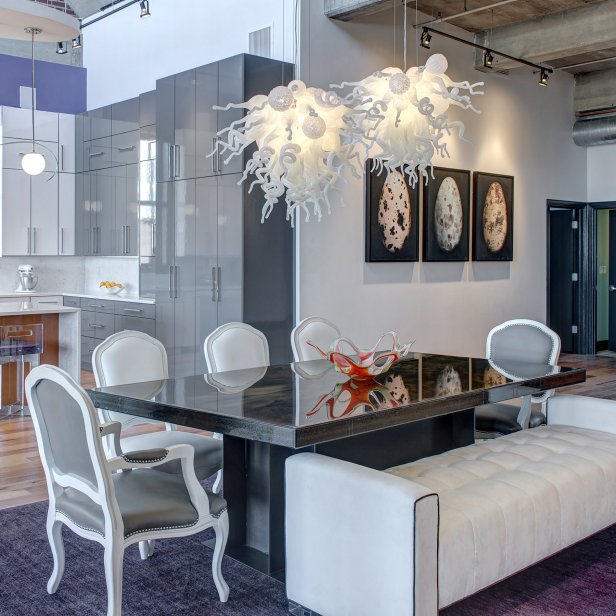 Open Dining Room With Metal Table & Glass Blown Chandeliers