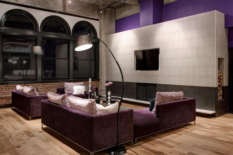 Urban Living Room With Modern Fireplace & Purple Sectionals