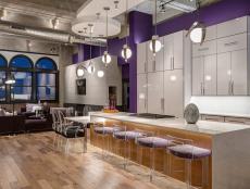 Purple Open Kitchen With Oversized Island & Modern Barstools