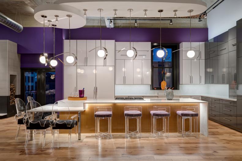 Loft Kitchen With Modern Barstools, Pendants and Streamlined Cabinetry