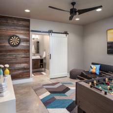 Transitional Multipurpose Game Room With Concrete Floor