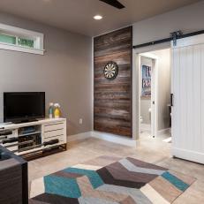 Transitional Game Room With Barn Door and Wood Wall Panel