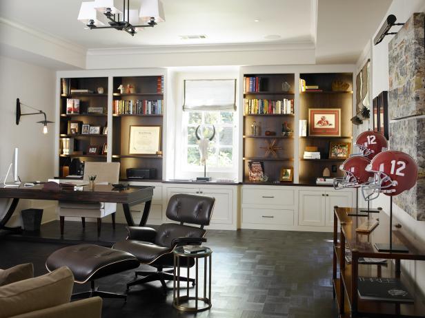 Home Office With Backlit Shelving, Football Decor and Dark Floor