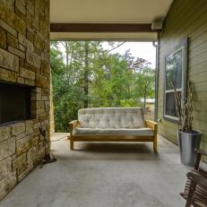 Country Deck With Stone Fireplace and Outdoor Sofa 