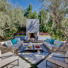 Mediterranean-Inspired Outdoor Room With Transplanted Olive Trees
