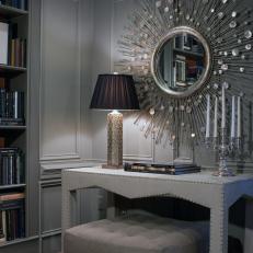 Sophisticated Library With Silver Sunburst Mirror and Custom Nailhead Trim Table
