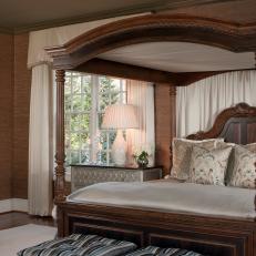 Transitional Master Bedroom With Canopy Bed and Striped, Tufted Ottomans