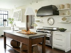 White Kitchen With Brown Wood Island and White Pendants