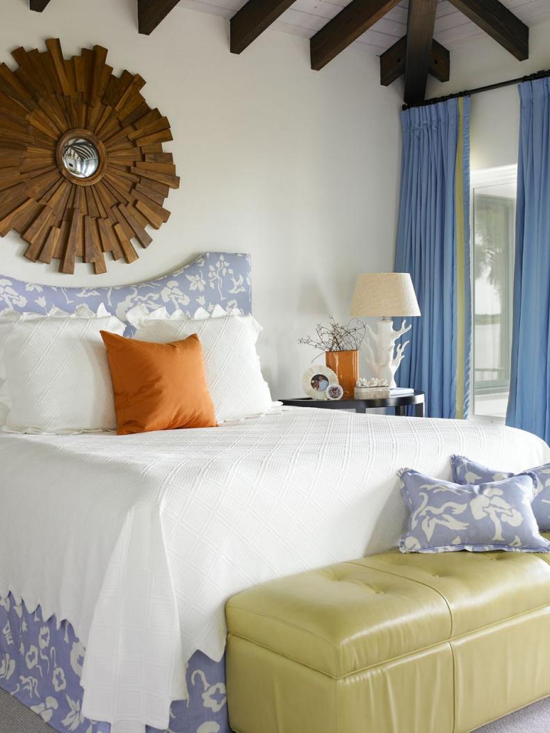 White Bedroom With White Bedding, Wooden Mirror and Green Bench