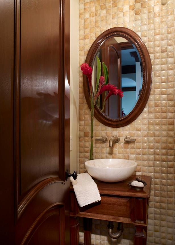 Small Neutral Mediterranean Bathroom With Round Wood Mirror