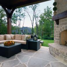 Cozy Outdoor Living Space With Rustic Stone Fireplace