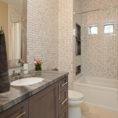 Sleek Tiled Bathroom With Gray Granite Countertops