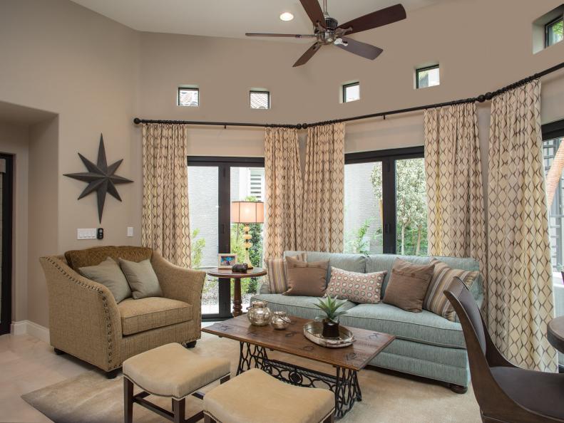 Open Neutral Living Room With Blue and Brown Accents