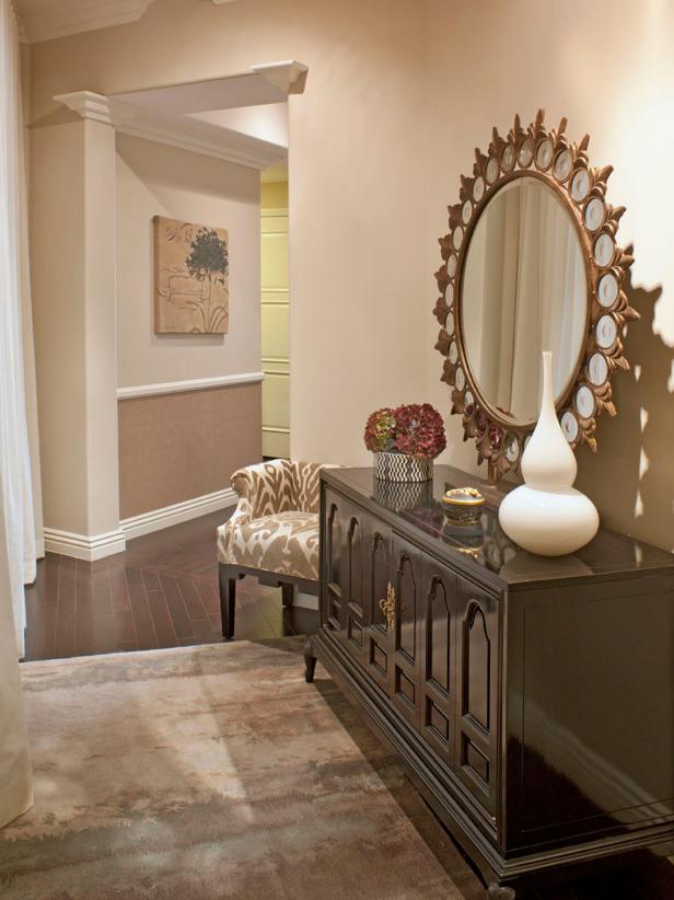 Transitional Neutral Entryway With Table and Round Mirror