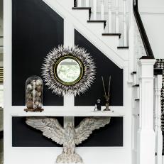 Dramatic Black-and-White Foyer With Eagle Console Table