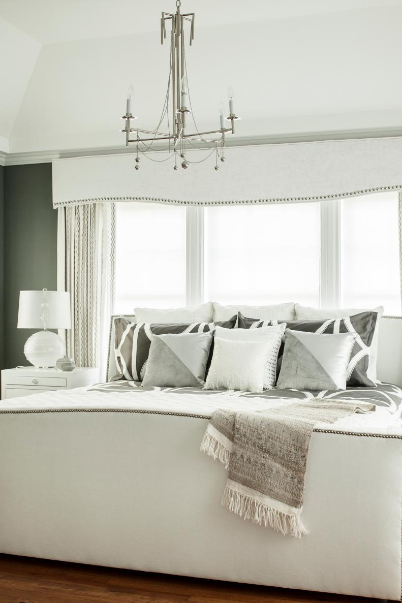 Transitional Gray Bedroom With White Upholstered Bed and Large Window