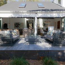 Transitional Deck With Plush Sofas, Contemporary Fire Pit and Accordion Door
