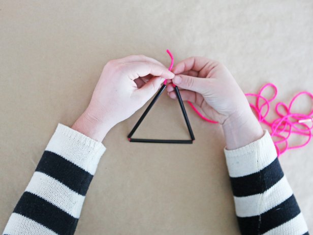 Step 4: Form straws into a triangle, then loop the string around in a loose knot.