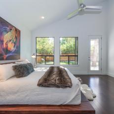 Modern Master Bedroom With Colorful Artwork 