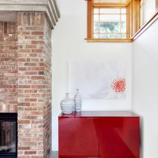 White Family Room With Contemporary Red Cabinet