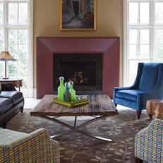 Colorful Transitional Living Room With Fireplace and Blue Armchair 