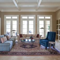 Classy Neutral Living Room With French Doors and Blue Chairs