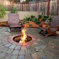 Backyard Fire Pit With Wooden Armchairs