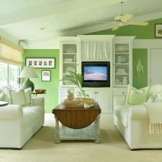 Green Cottage Living Room With Plush White Sofas