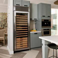 Contemporary Kitchen With Gray Cabinets and Wine Fridge