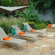 Poolside Stone Patio With Lounge Chairs