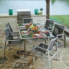 Outdoor Dining Area With Metal Table and Chairs