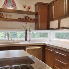 Midcentury Modern Kitchen With Wood Cabinetry, Long Windows and Mauve Dish Display