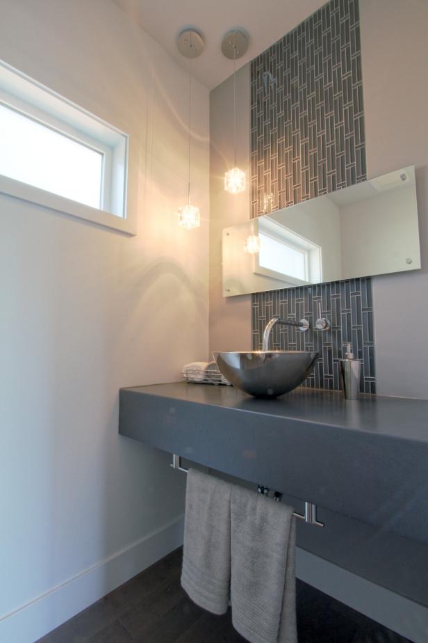 Modern Bathroom With Gray Tile Accent Strip And Stainless