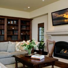 Traditional Neutral Family Room With Wooden Bookshelf