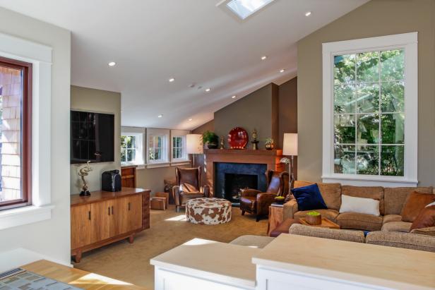 Neutral Transitional Living Room With Slanted Ceiling And